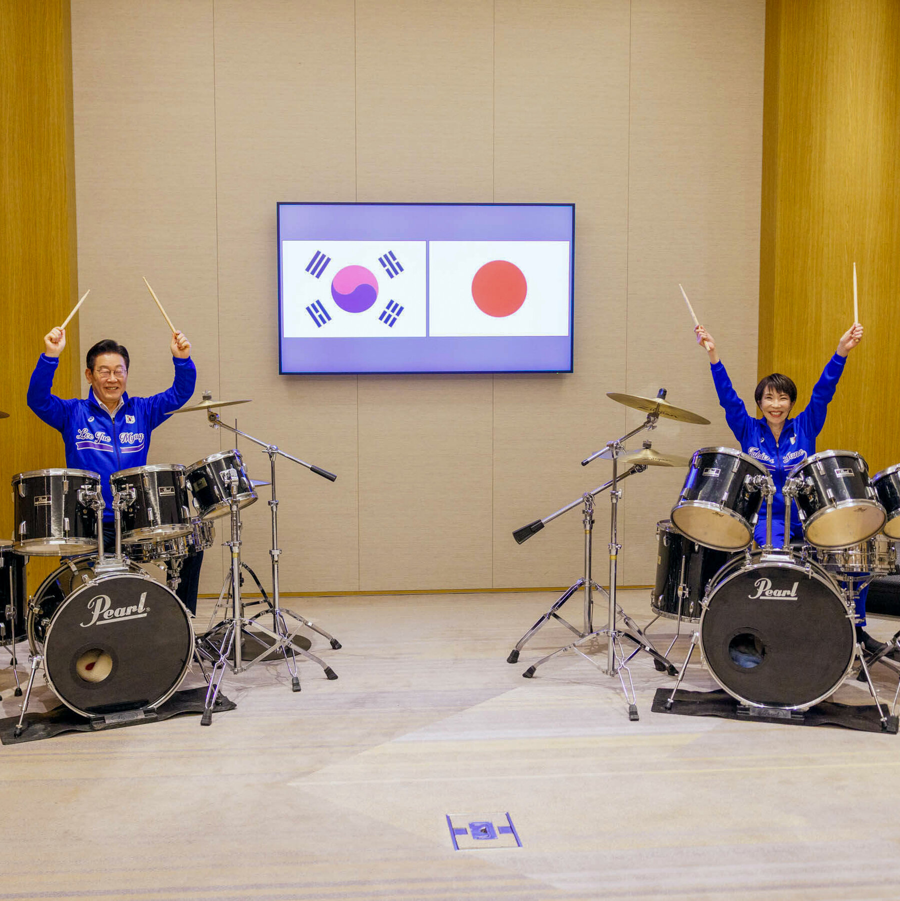 Watch the Leaders of Japan and South Korea Jam to K-pop on the Drums
